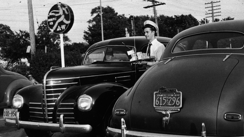 Waiter serving cars at Hot Shoppes location