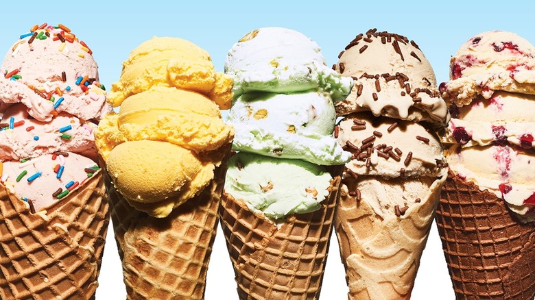 Five ice cream cones on a blue and white background