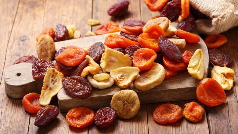 Mix of dried fruits on wooden table