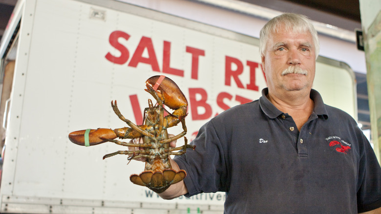 Man holding a lobster
