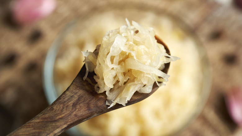 Sauerkraut on wooden spoon