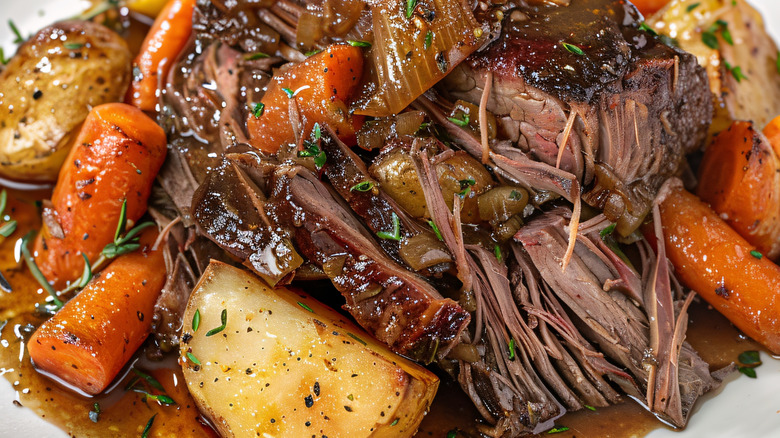 Up-close view of pot roast and vegetables on a plate