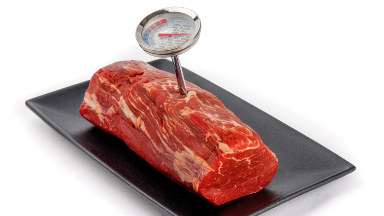 Roast with a meat thermometer inserted into it