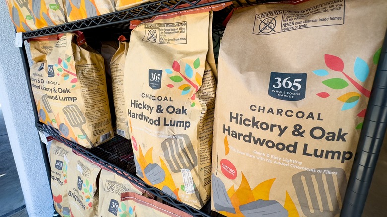 Bags of lump charcoal at Whole Foods