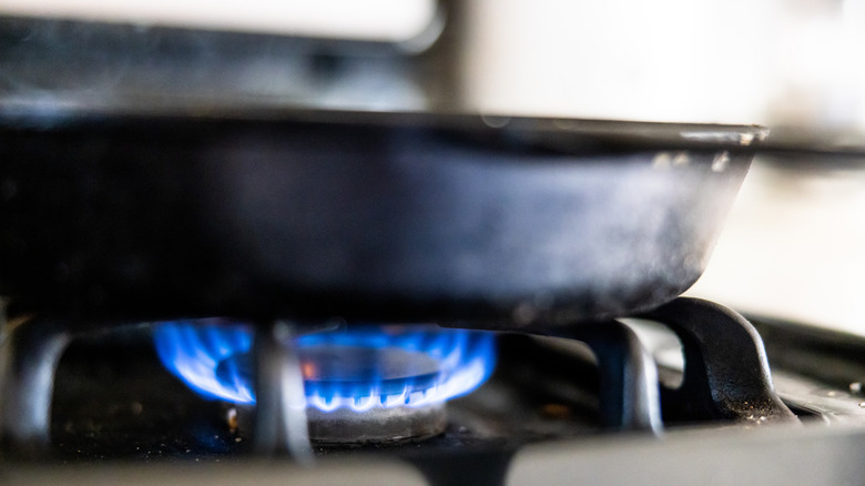 Cast iron skillet over gas burner