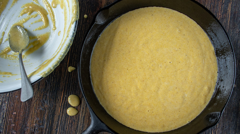 Cornbread batter in cast iron skillet