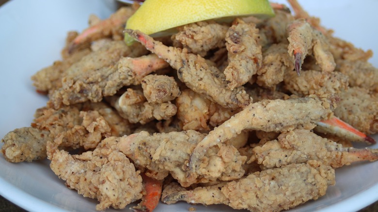 Plate of Fried crab claws with lemon slice garnish from Cobalt Restaurant
