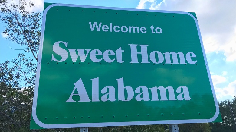 A Welcome to Sweet Home Alabama road sign