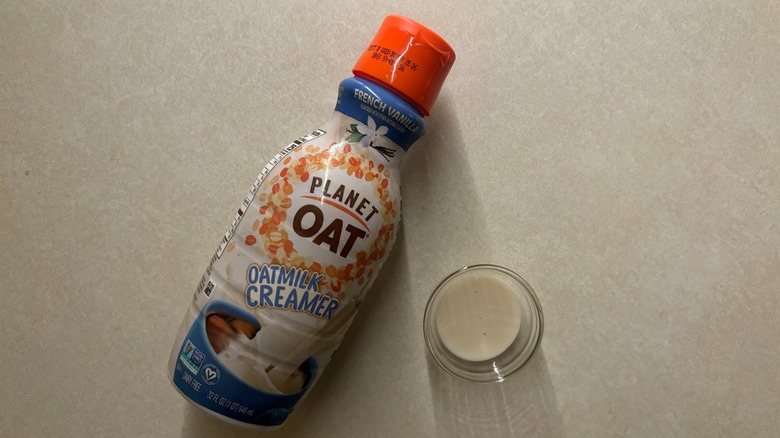 Planet Oat French Vanilla Oatmilk Coffee Creamer bottle and creamer in ramekin