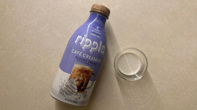 Ripple Classic Creme Dairy-Free Cafe Creamer bottle and creamer in glass ramekin on countertop