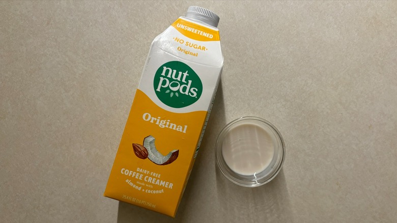 Nutpods Unsweetened Original Coffee Creamer carton and creamer in glass ramekin on countertop
