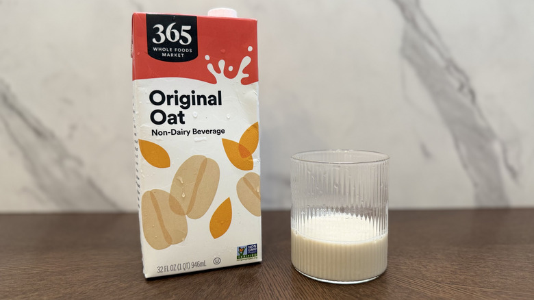 Glass and carton of 365 oat milk