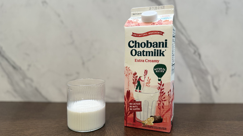 Glass and carton of Chobani oat milk