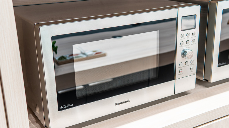 Panasonic microwave on a shelf
