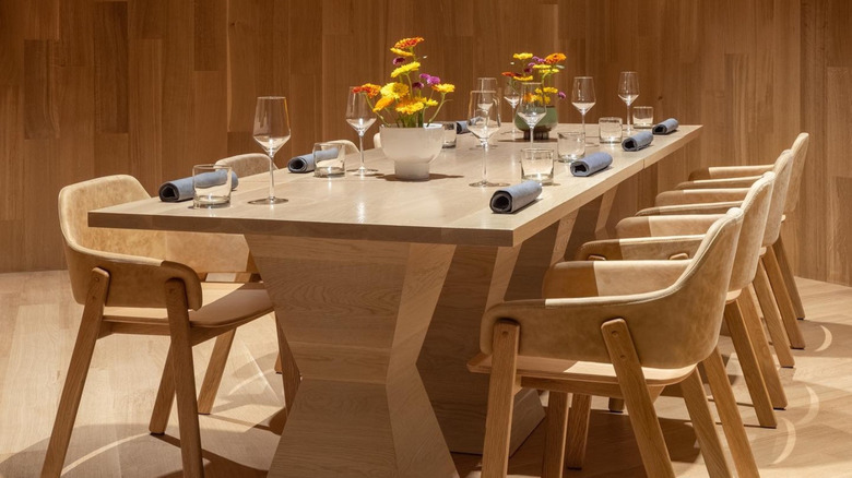An elegantly set table in the wood-paneled dining room at Nonesuch restaurant in Oklahoma City