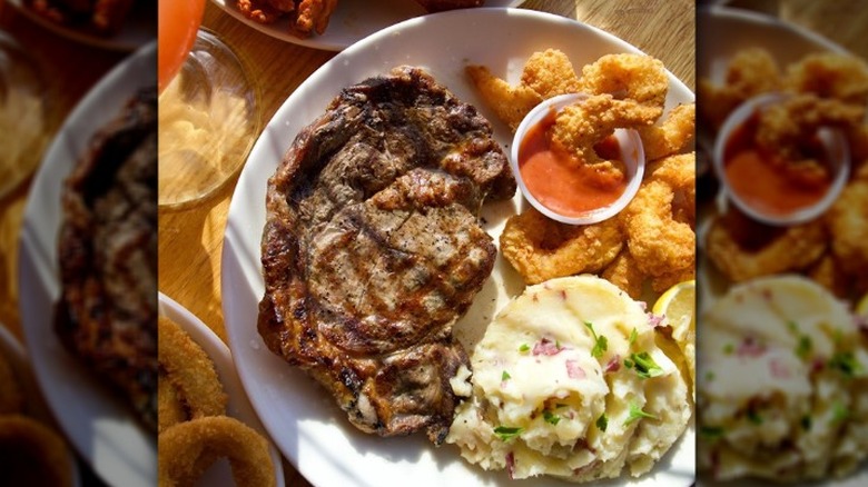 One Applebee's steaks paired with crispy shrimp and mashed potatoes.