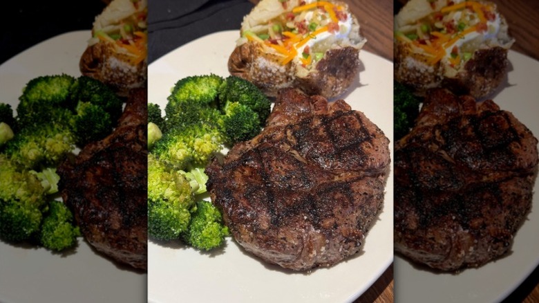 Steak, broccoli, and a baked potato from Outback Steakhouse.