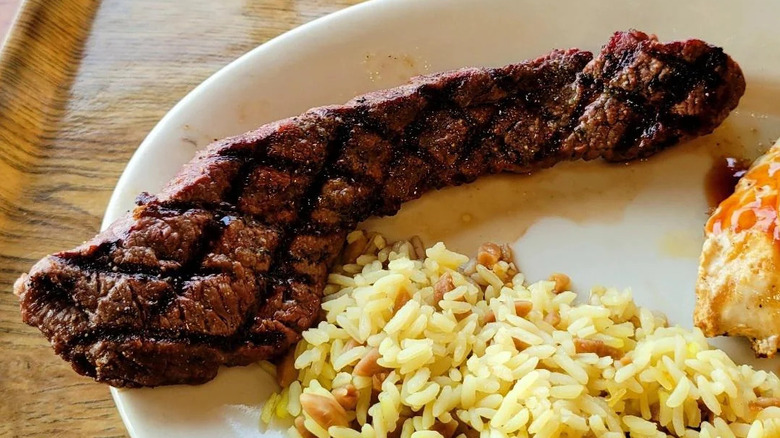 An oddly-shaped steak that customer was served at Sizzler.