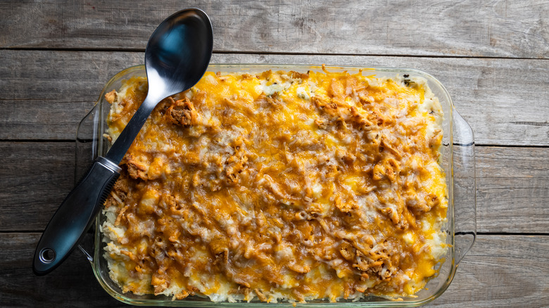 Chicken casserole in a baking dish with a spoon