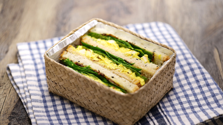 Coronation chicken salad sandwiches in a white box