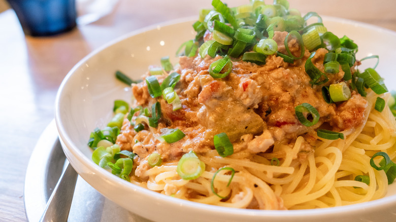 Spaghetti covered in vague pink sauce