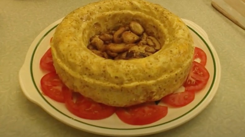 Noodle ring filled with mushrooms