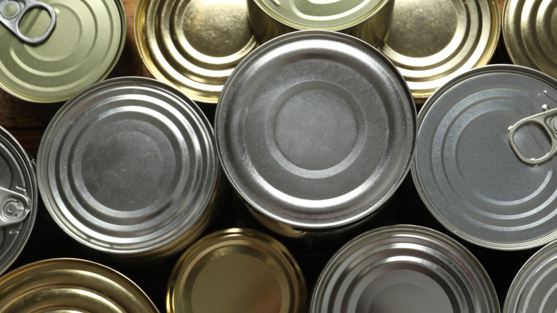 Top view of several unopened cans of food