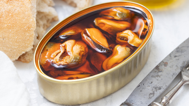 Open tin of canned mussels