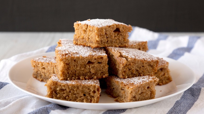 Homemade applesauce cake slices on a white plate