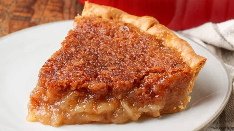 A slice of mock apple pie on a white plate