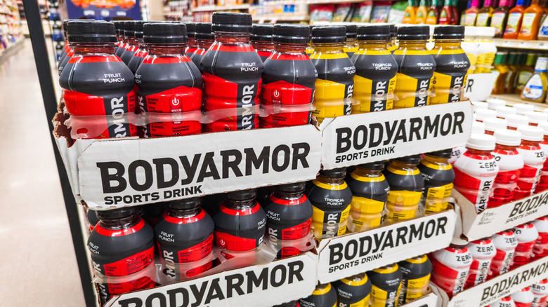 Large cases of bottles of BodyArmor sports drinks at a grocery store