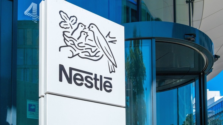 The Nestlé logo in front of an office building.