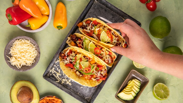 Vegan Tacos Wraps Tex Mex food with beans, avocado, roast cauliflower and vegetables