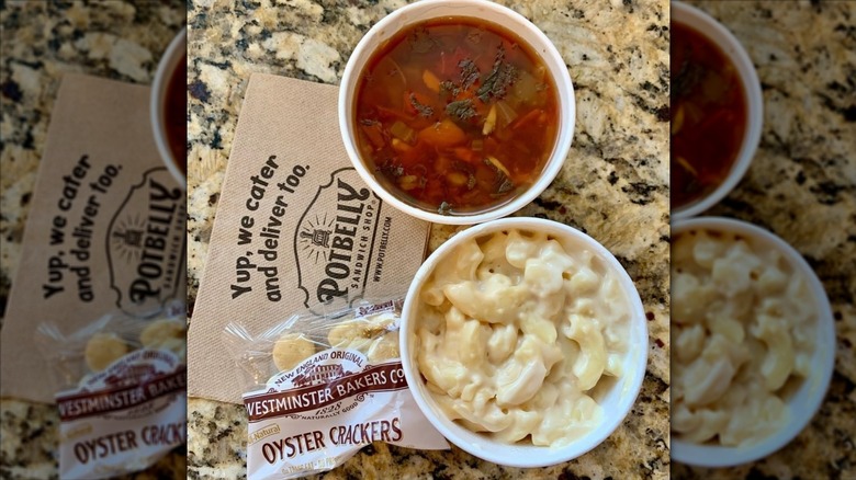 A to-go bowl of Potbelly's Garden Vegetable Soup with a napkin underneath it.