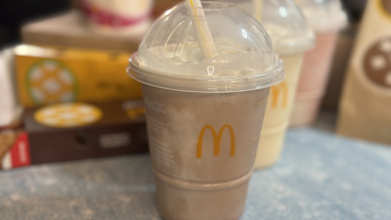 McDonald's Chocolate shake with straw