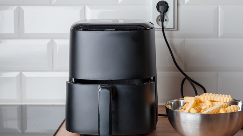 Airfryer placed on a wooden countertop