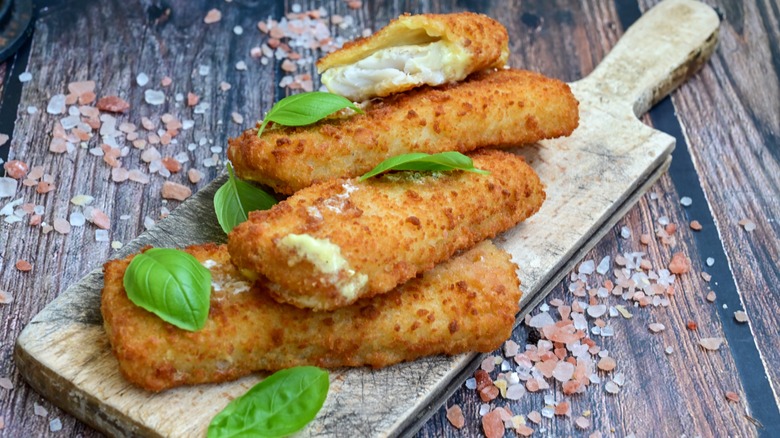 Close up of crispy breaded deep fried fish fingers