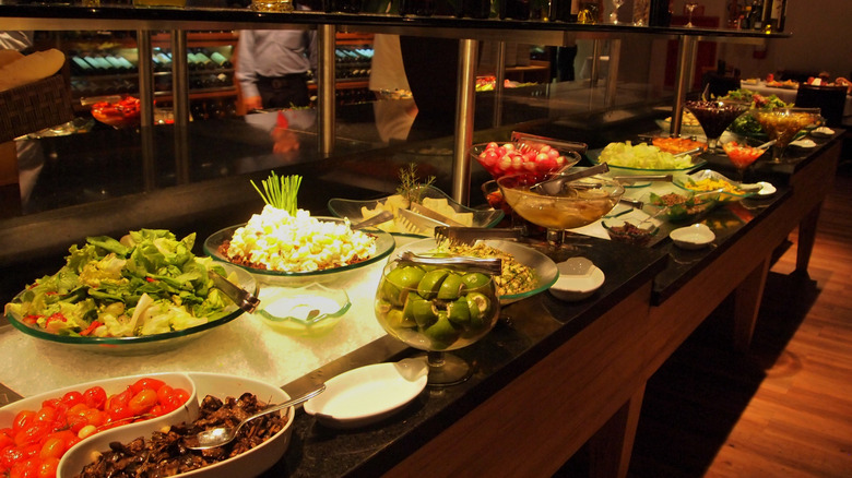 A self-service salad bar within a Brazilian steakhouse.
