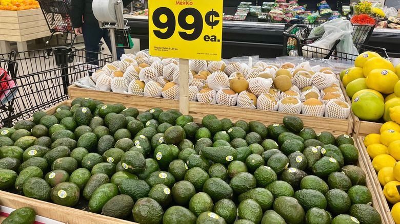 Sale sign above Hass Avocados at grocery store