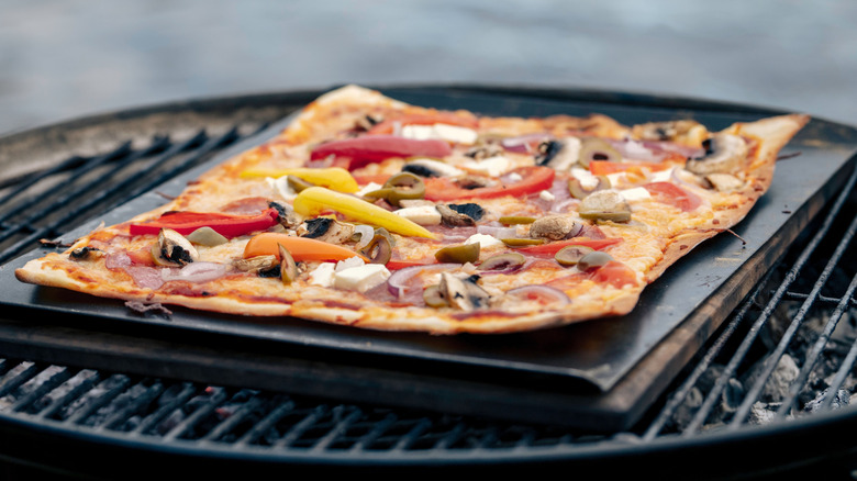 pizza grilling on a grill