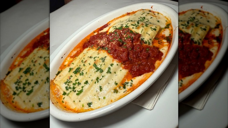 Serving of Brio Italian Grille Oven-Baked Lasagna in an oval white dish