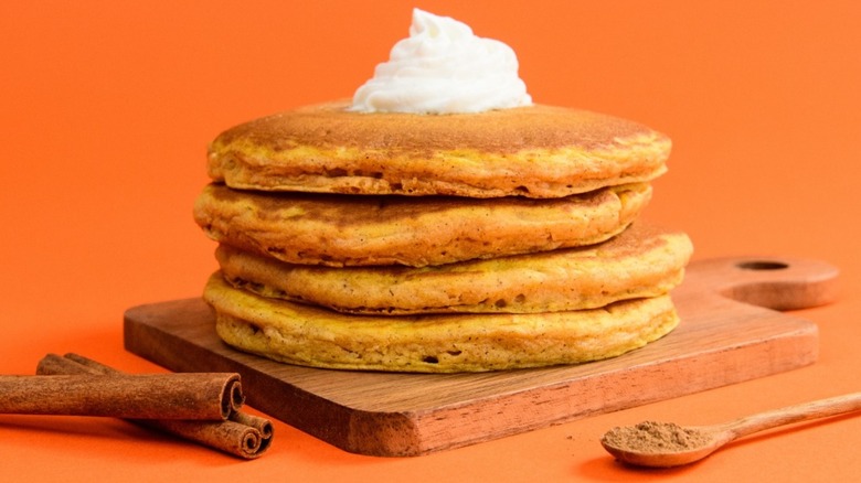 pumpkin pancakes from IHOP posed with cinnamon sticks and ground cinnamon