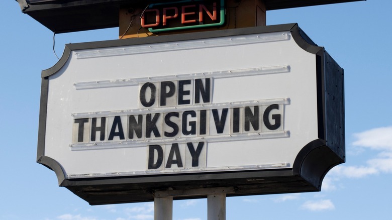 restaurant sign touting Thanksgiving opening