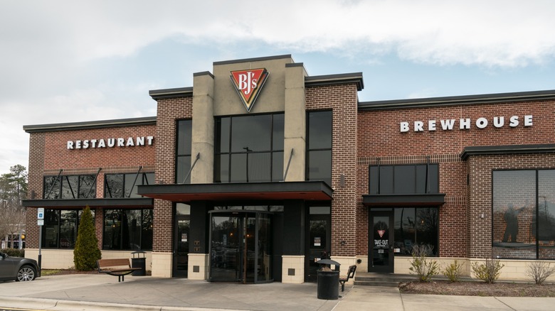 Exterior of BJ's Restaurant & Brewhouse against cloudy sky