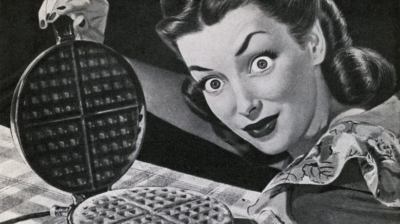 crazy looking lady opening a waffle iron... found it humorous!