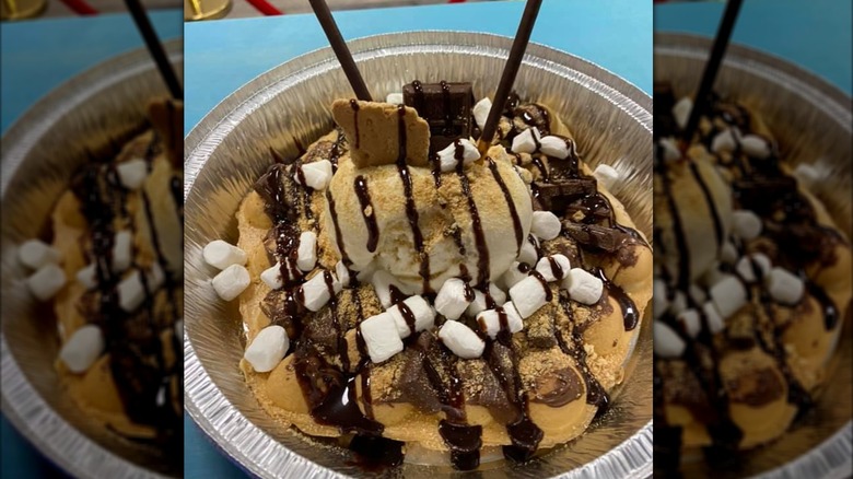 Smores Belgian Waffle with ice cream and chocolate drizzle in aluminum takeout container