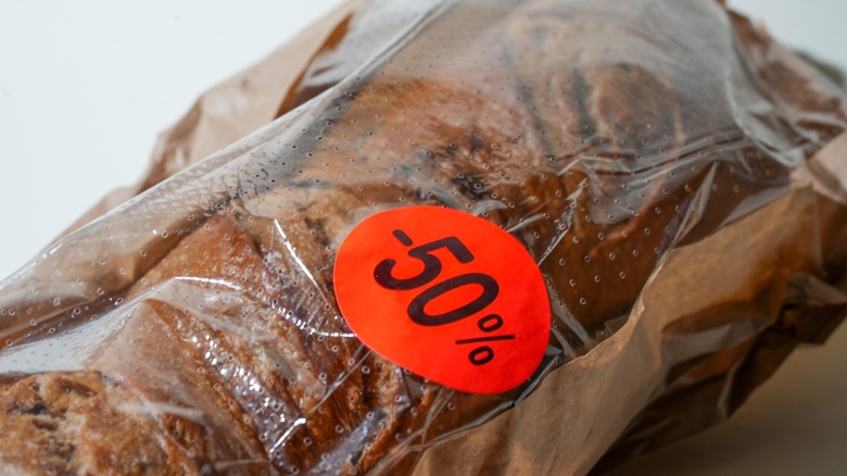 Close up of fresh bread featuring a 50% discount sticker