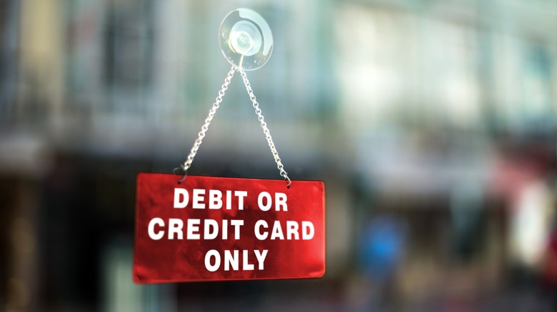 Red sign saying "Credit or debit card only"