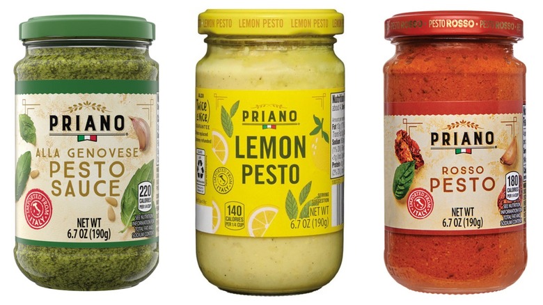 Jars of Priano alla Genovese, lemon, and rosso pesto sauces on a white background.