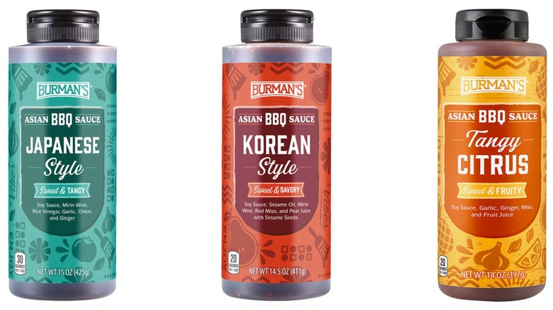 Three bottles of Burman's Asian barbecue sauce in Japanese style, Korean style, and Tangy Citrus flavors on a white background.